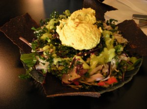 Creamy eggless "egg" salad made with nuts, diced celery, scallions, served on a fresh bed of greens with flax crackers for dipping