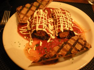 Thin grilled eggplant stuffed with a homemade faux ricotta cheese topped with marinara sauce
